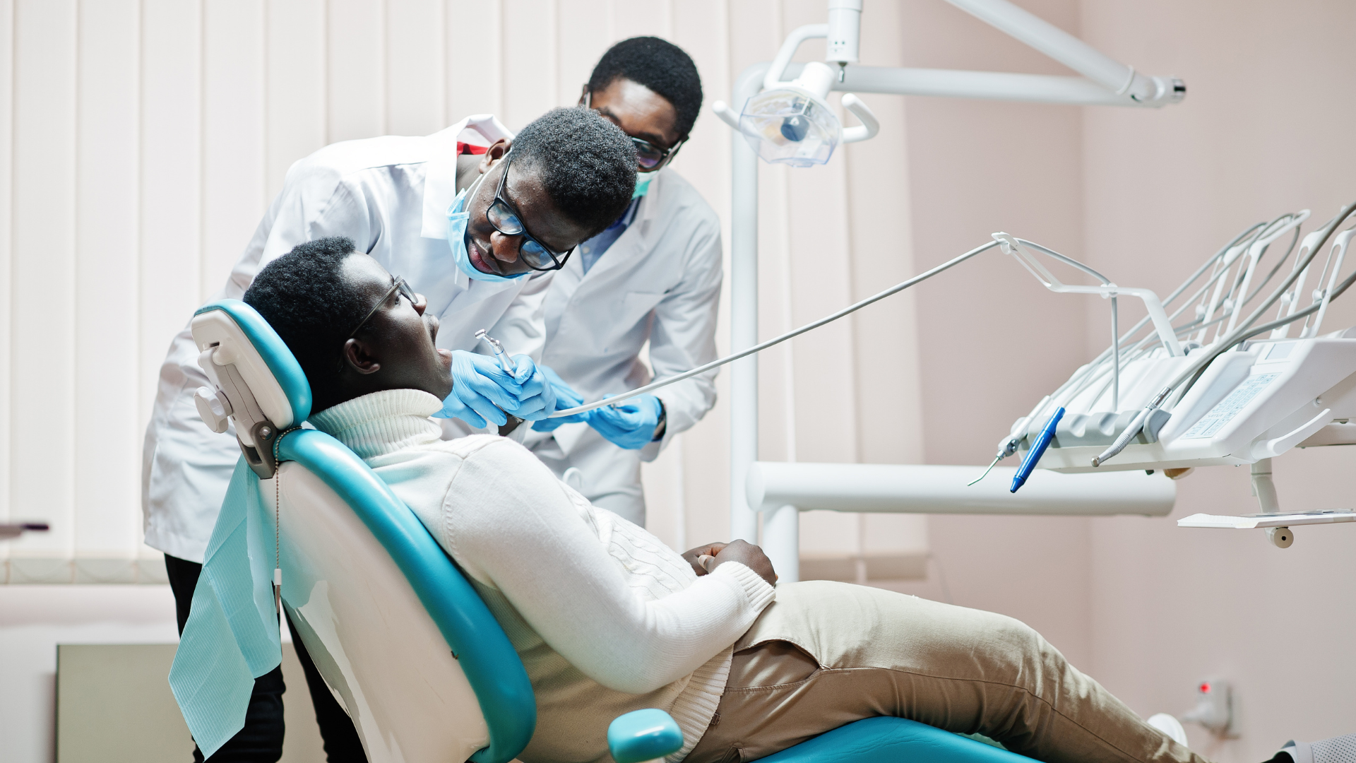 african-american-man-patient-dental-chair-dentist-office-doctor-practice-concept-professional-dentist-helping-his-patient-dentistry-medical-drilling-patient-s-teeth-clinic